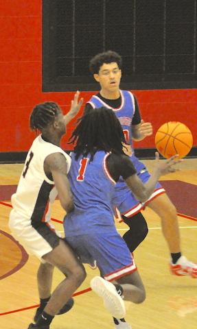 Stephens County’s C.J. Harbin (3) pressures an Oglethorpe player with the basketball here last Friday.