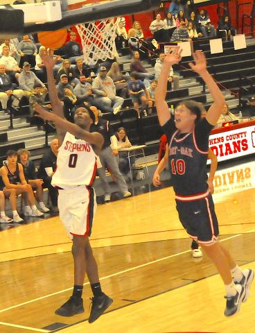 Despite the desperation shout of a West-Oak defender, Jaylen Haney (0) of the Indians registers a layup for a score.