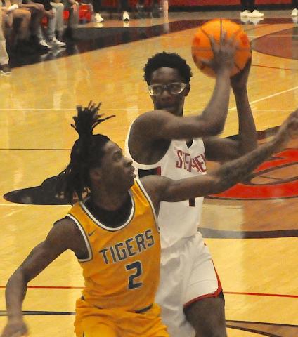 Indian guard Jayden Haynie muscles past a defender to get off a shot during last week’s basketball contest with Washington-Wilkes.