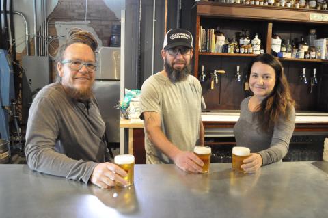 Travis Kruger, Fritz Koch, and Regina Kruger are in charge of the new Sage Street Aleworks in downtown Toccoa, a brewery that inhabits the historic Stewarts Drugs building. The Krugers have kept the Stewarts Drugs sign hanging above the entrance, and the pharmacy cabinet has been converted into the brewery’s beer wall.