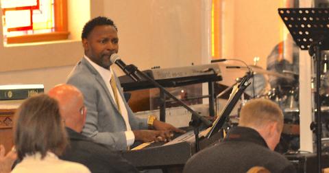 Trinity CME Church Elder Charles Thompson leads the congregation at a Dr. Martin Luther King, Jr., celebration on Monday, Jan. 19, in song and worship.