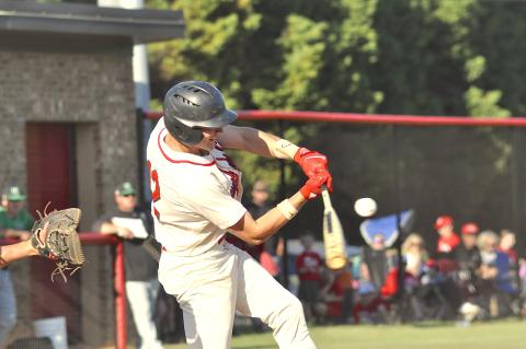 Branson Stowe is about to make contact with the ball.