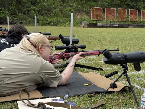 Stephens County jailer Hannah Murphy looks through the scope on her rifle at the third annual Cops v. Kids event at the Stephens County Sheriff’s Office on Saturday, May 9. The 4-H rifle team took home the prize during the competition.