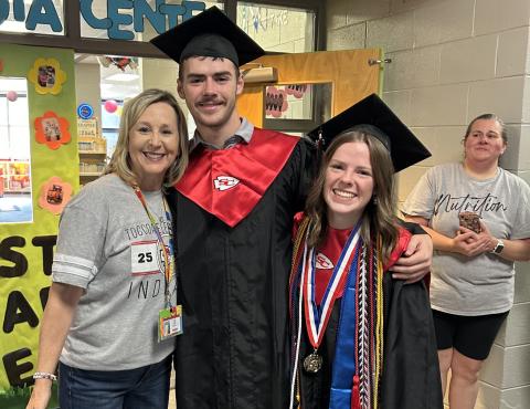 Ethan and Allyson Green, who are graduating from Stephens County High School tomorrow night, embrace their aunt, Toccoa Elementary School media specialist Amy Lee, during the traditional Senior Walk at the elementary school last week.
