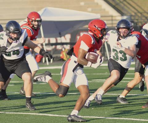 Indians running back Ashton Winters looks for running room.
