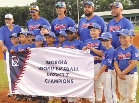 Toccoa Rookie League all-stars and their coaches celebrated the District 7 championship in Hartwell Monday night. Team members are (not in order) Kingston Schultz, Chase Hickman, Huck Thomas, Easton Koppin, Rex Youngblood, Grayson Turk, William Stein, Elijah Newkirk, Cohen Gastley, Jasper Ebadolahi, Emerson Edge and Cooper Teater. In the back are Toccoa Little League president Doug McCollum and all-star coaches Michael Koppin, Luke Youngblood, Kaleb Turk and Zac Stein.