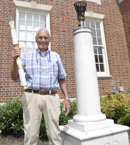 William Tucker was one of the 17 individuals selected to carry a torch during the 1996 Summer Olympics, which were held in Atlanta July 19 through Aug. 4, 1996. On Tuesday, he was photographed standing next to the eternal flame statue in front of Toccoa City Hall.