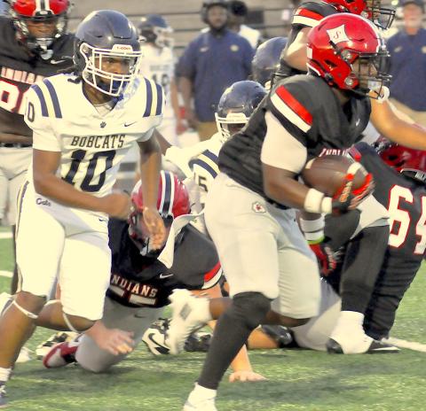 Running back Jasian Wiley looks for room against Seneca.