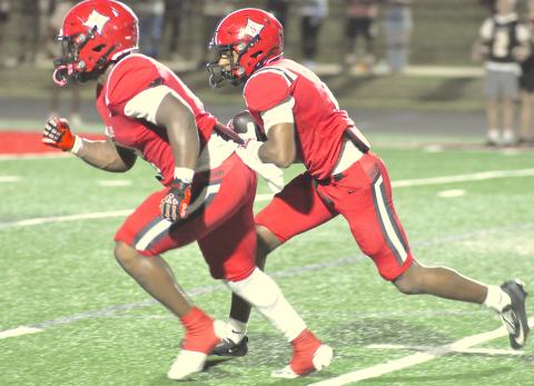 Ashton Winters follows the blocking of Jasiah Wiley.