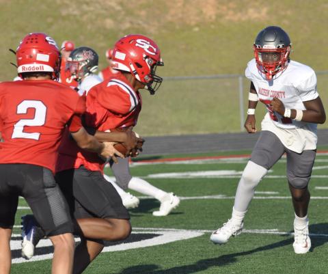 Keegan Howard takes a handoff.