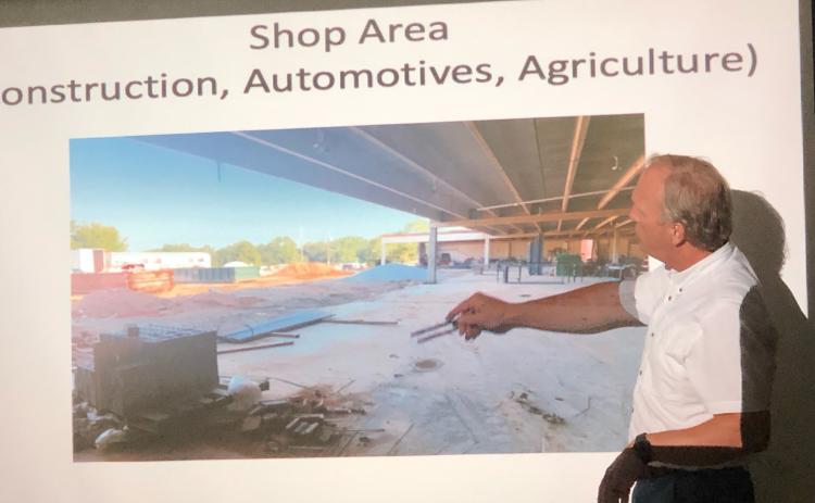 School superintendent Bryan Dorsey shows school board members the ongoing work that’s underway at the high school, an area into which automotive, construction and agriculture classes will move.