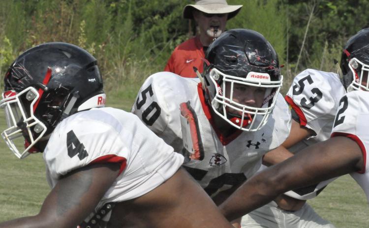 Lineman William Rudeseal (50) mixes it up during a recent practice session drill. Rudeseal and his teammates will have a pre-season scrimmage with White County this evening.