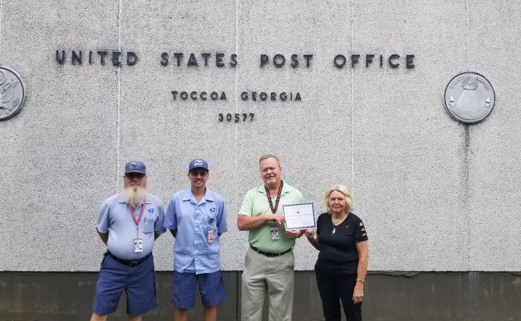 Pictured are (from left) Toccoa postal worker and U.S. Navy veteran Joe Shrode, postal worker and U.S. Army veteran Michael Waddell, Toccoa postmaster Brett Franklin and VFW Auxiliary senior vice president Martha Dysinger.