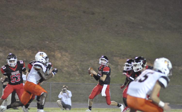 Kenny Colwell looks to pass against Hart County