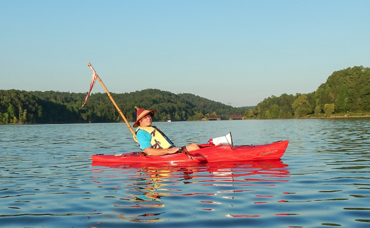 Local historian Kelly Vickers leans back and soaks in the beauty that is the Tugaloo River Sunset Paddle held the Saturday before Labor Day.