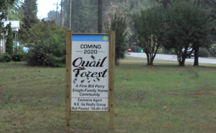 A sign near the intersection of Roselane and Skyline Drive heralds Bill Perry’s new development.