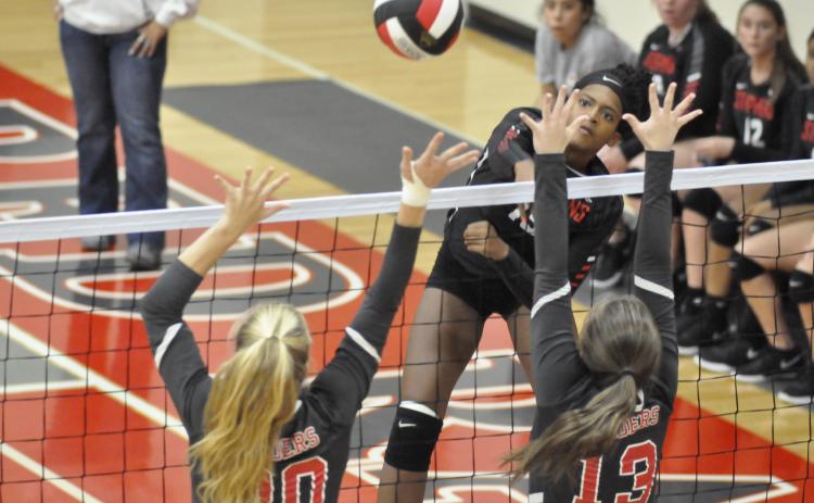Ranajah Verdell sends a spike into Madison County's defense