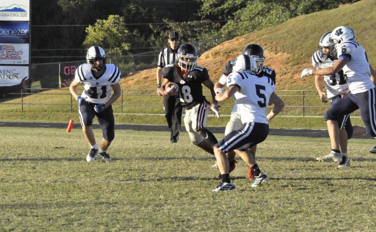 Bryson Trimier runs the ball against White County