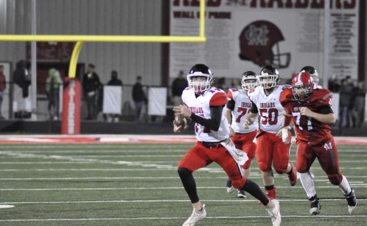 Stephens County quarterback Kenny Colwell sprints for extra yardage in a game from last Friday. SCHS teams will be competing in AAA instead of AAAA next season.