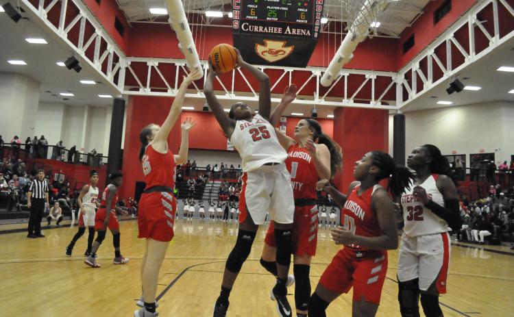 Ranajah Verdell grabs a rebound against Madison County