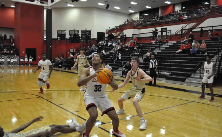 DJ Hampton looks to score against St. Pius