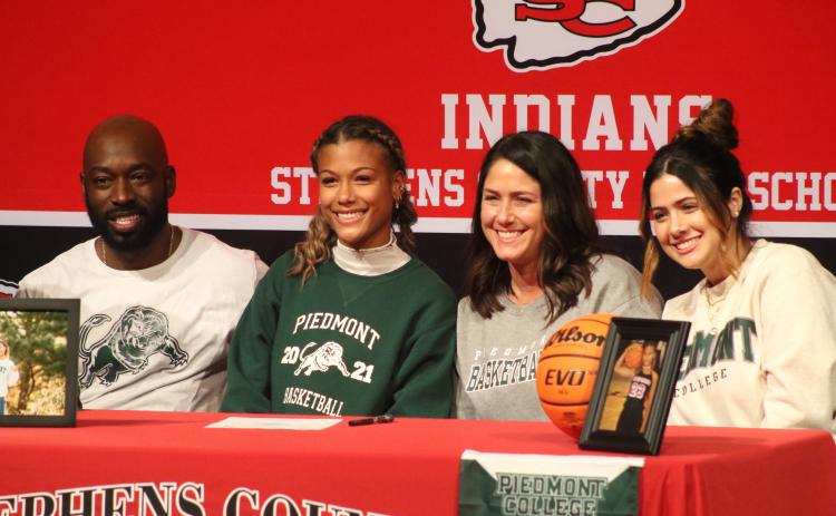 Kiki Howard and family during her signing ceremony
