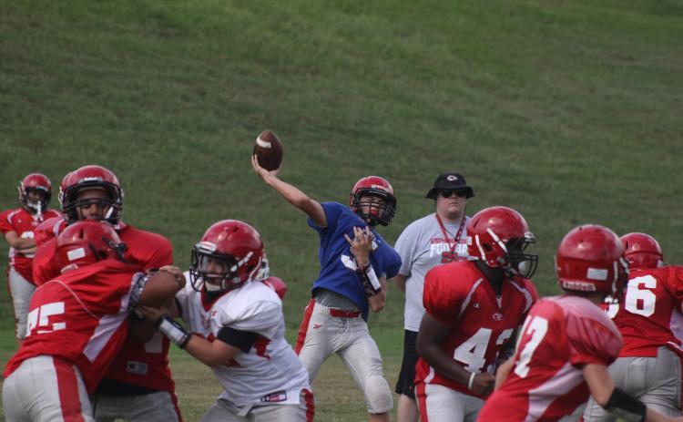 Branson Stowe throws a pass during a SCMS practice.