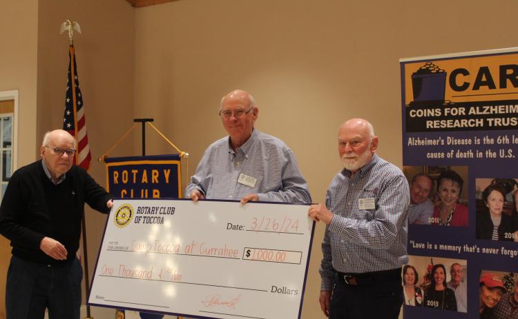 The Toccoa Rotary Club presented Warren Johnston, right, a check for $1,000 for Camp Toccoa at Currahee.