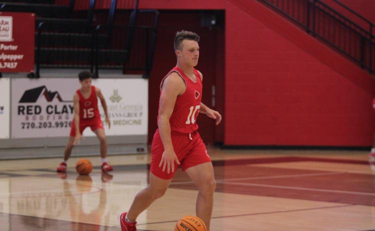 Rising senior Brock Tankersley dribbles the ball down the court.