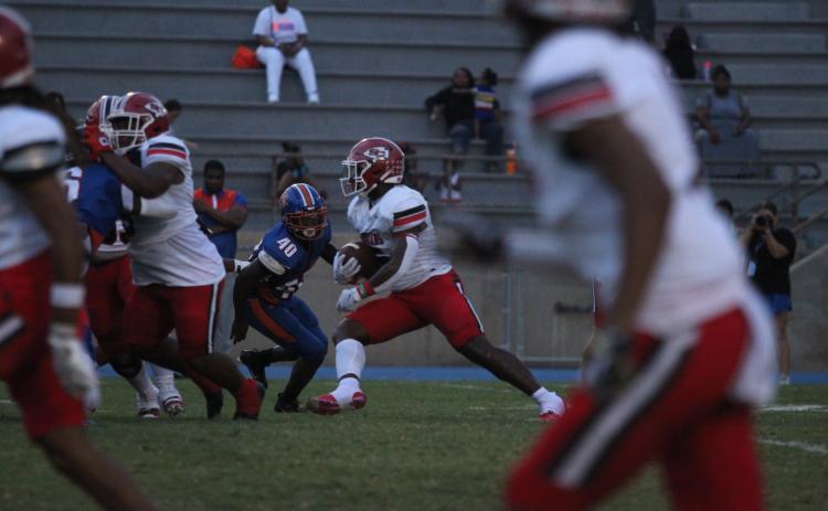 Senior Running Back Javin Gordon looks for a hole to run through in Friday night's game against Cedar Shoals.
