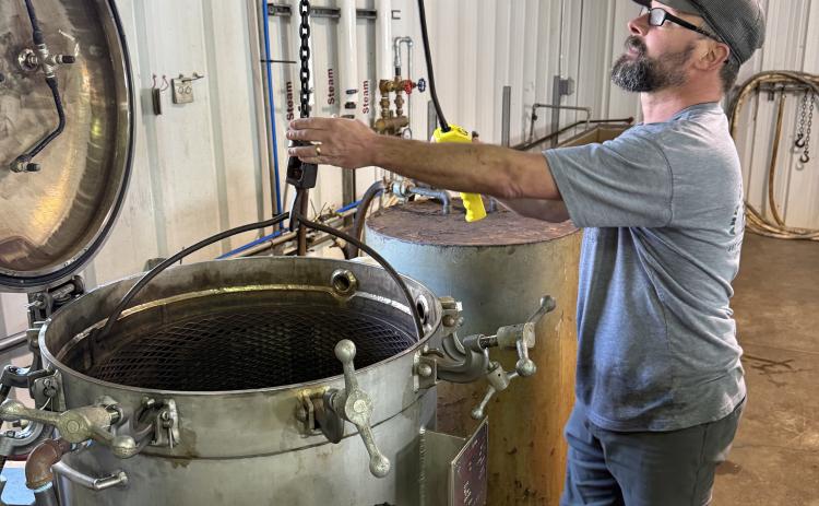 Richard Johnson working on canning at the Eastanollee Cannery.
