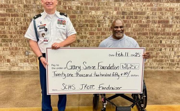 JROTC senior instructor LTC (Ret) David Priatko presented a $21,250 check to his West Point classmate and Gary Sinise Foundation board member Col. (Ret) Greg Gadson at the SCHS African American History Program.
