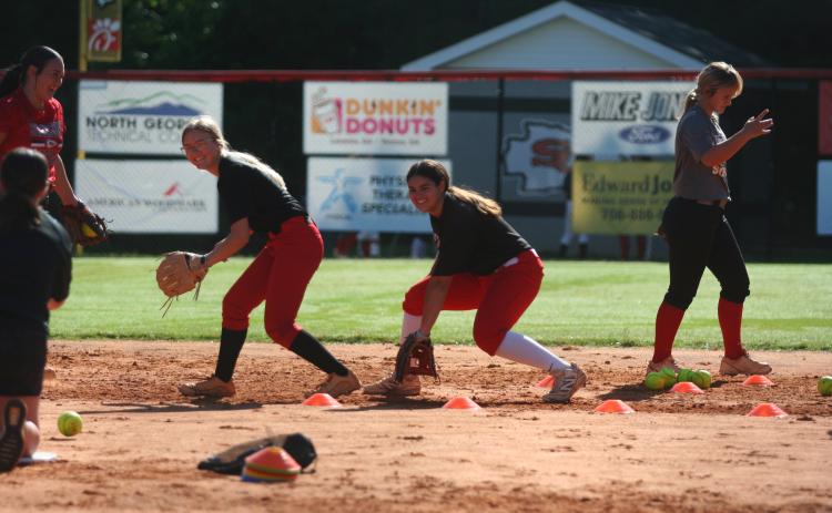 Gracie Donaldson and Alana Thurmond practice their drills during summer workouts. Photo by Laura Shaw