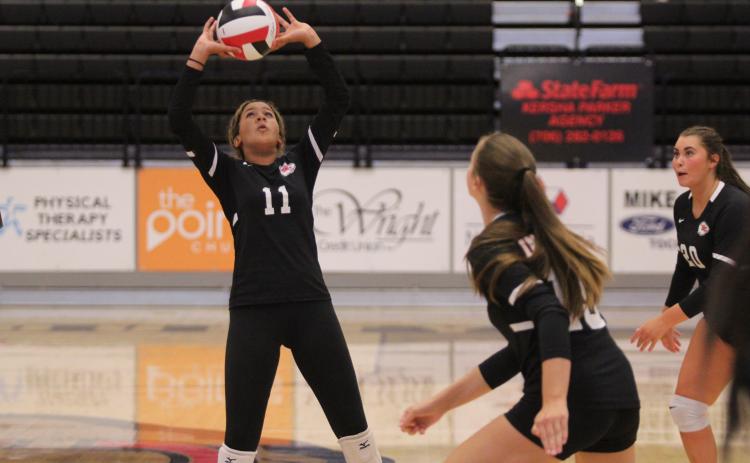 Jazzy Russell sets the ball during a game last season. Photo by Laura Shaw