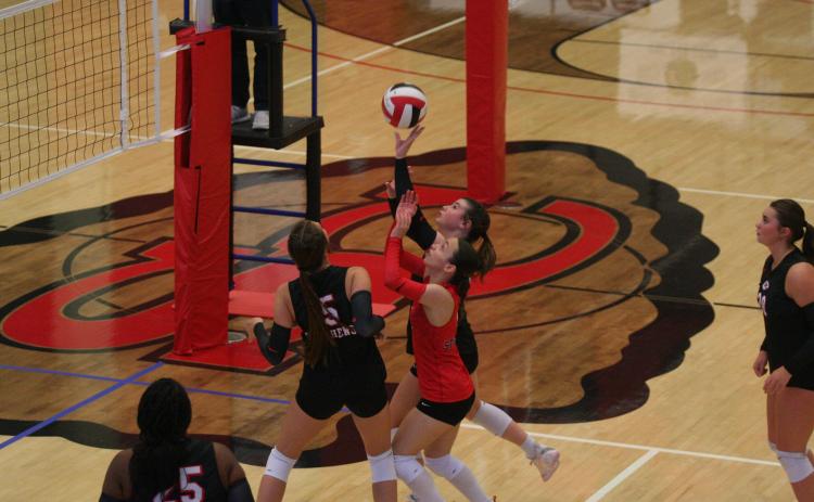 Callie Hunter, Tia Bramlett, and Lauren Schell rush the ball. Laura Shaw/The Toccoa Record.