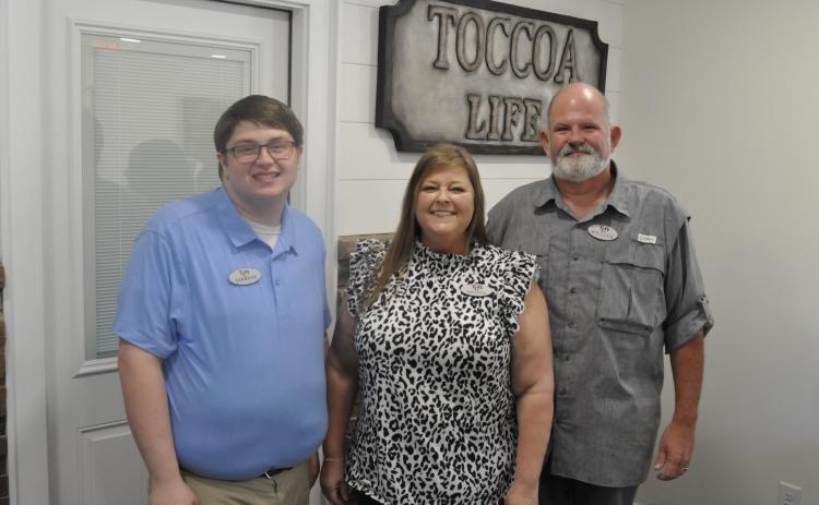 The Toccoa Family Life Resource Center has opened a new headquarters. This is the first time in the organization’s 40 year history that it has had a permanent building in town. Pictured are Toccoa Family Life Center Executive Director William Brothers, his wife, Amanda, and the facility’s office manager, Jarrett. Michael O’Hearn/The Toccoa Record