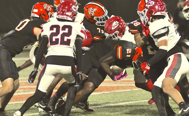 A trio of Indian defenders, including Isaiah Arthur (22), close in on a Hart ball carrier to prevent a long gain. Photo by Tom Law/The Toccoa Record.