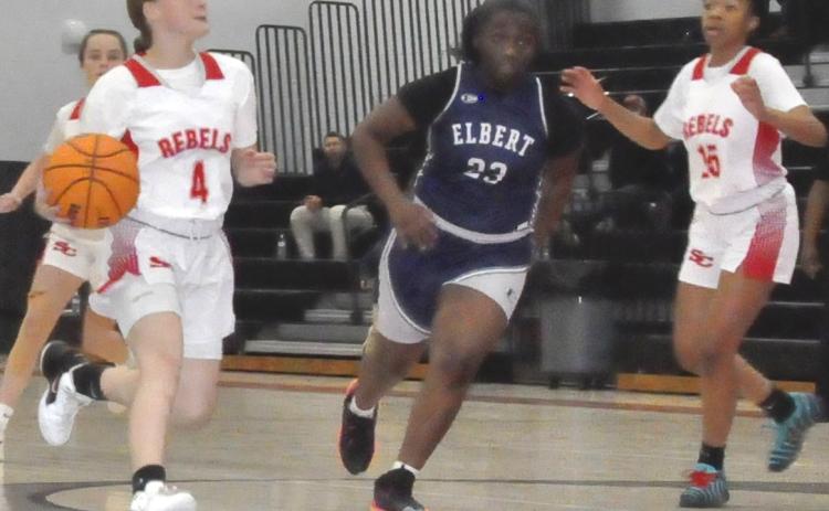 Ella Fletcher (4), left, drives to the hoop against Elbert.