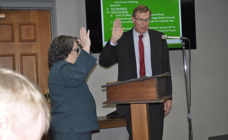 City commissioner Evan Hellenga was sworn in for another term and unanimously named the city's mayor for 2026 during the city commission's meeting on Monday, Dec. 22.