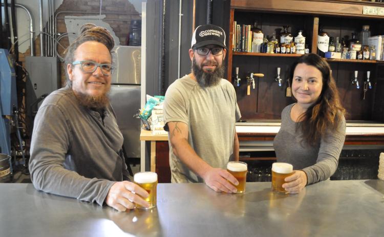 Travis Kruger, Fritz Koch, and Regina Kruger are in charge of the new Sage Street Aleworks in downtown Toccoa, a brewery that inhabits the historic Stewarts Drugs building. The Krugers have kept the Stewarts Drugs sign hanging above the entrance, and the pharmacy cabinet has been converted into the brewery’s beer wall.