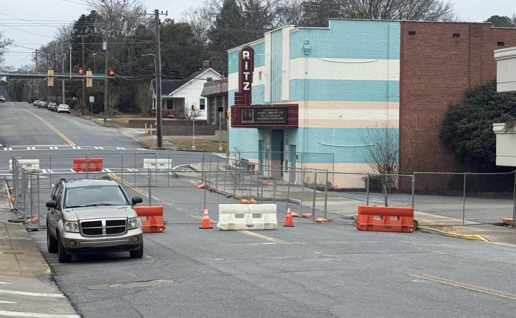 Work on a $3 million expansion project at the Ritz Theatre in downtown Toccoa has begun, as indicated by a portion of Doyle Street being fenced off to be used as a staging area for construction materials.
