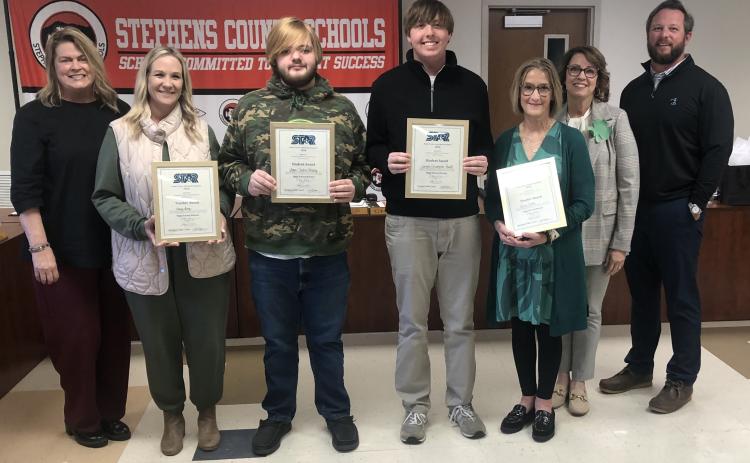 On Tuesday night, March 17, the Stephens County Board of Education honored the high school’s two STAR students and teachers.The STAR students are Logan Shirley and Landon Powell, while the STAR teachers are Kasey Ivey and Lynne Fisher. Shirley and Powell got the same SAT score. They were joined by, from left to right, Toccoa-Stephens County Chamber of Commerce President Julie Paysen, superintendent Connie Franklin, and Board of Education chair Tripp Arrowood.