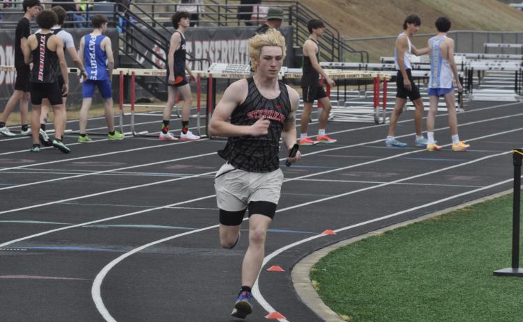Garrett Krous races around the track at Stephens County High School during the Currahee Relays on Saturday, March 7.