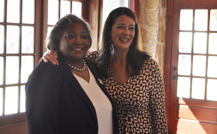 Shantelle Grant, left, is the children's services coordinator with the Toccoa-Stephens County library. Last week, she was honored for receiving Employee of the Year by the Georgia Public Library Service. She's being embraced by Delana Knight, director of the Northeast Georgia Regional Library System.