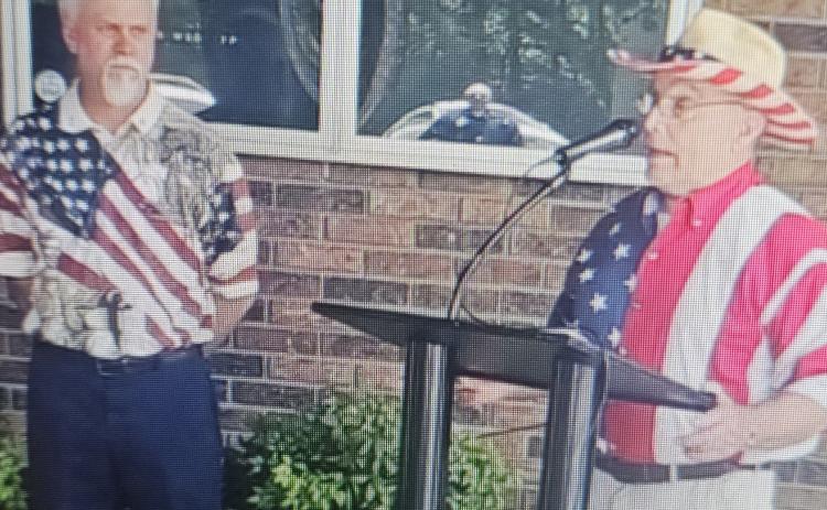 Stacey Simmons, left, and Roy English, right, participated in the Toccoa Elks Lodge's Flag Day ceremony on June 14.
