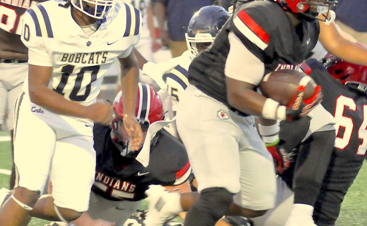Running back Jasian Wiley looks for room against Seneca.