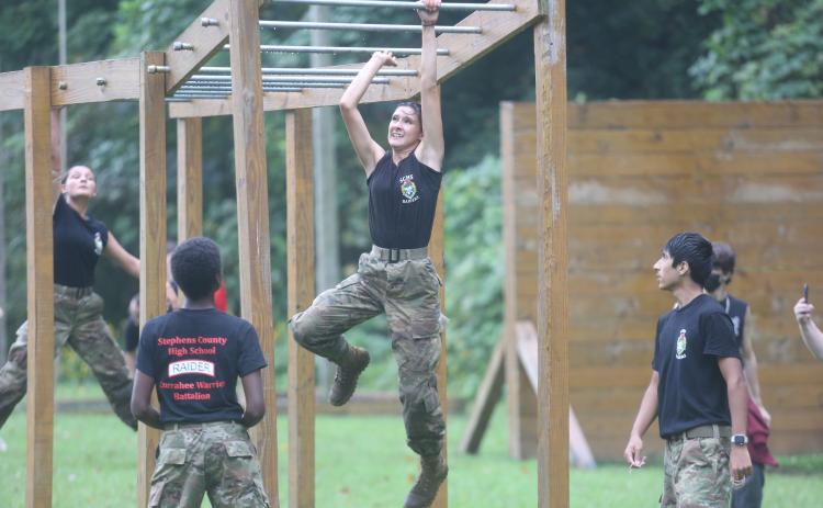 Amidst the pouring rain on Saturday, Sept. 12, the Stephens County High School for the first time hosted a JROTC Raiders meet behind the school. The group built an obstacle course for the event, and several regional schools flocked to Toccoa to participate from as far away as Athens-Clarke County. Swinging from the monkey bars here in the downpour is Bethany Byrd.