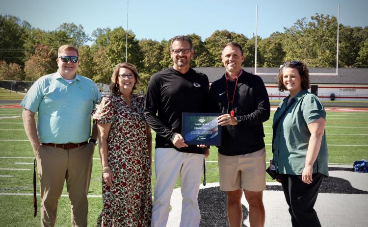 The Stephens County Indians football team received the Atlanta Journal Constitution/Georgia High School Football’s Team of the Week award on Thursday, Oct. 8, for its stunning performance against Hart County on Friday, Oct. 2. During that game, the Indians had a wild comeback win over the visiting Bulldogs, rallying from a 22-point deficit in the first half to beat Hart 44-28. Accepting the award on behalf of the Stephens County School System were assistant schools superintendent John Stith, SCSS superinten