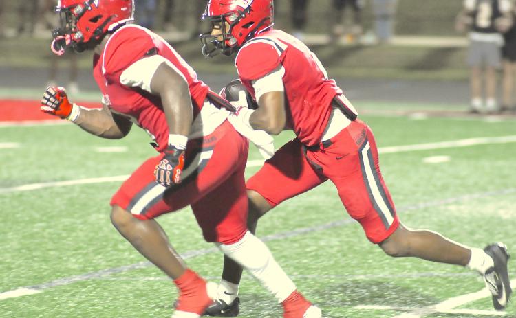 Ashton Winters follows the blocking of Jasiah Wiley.