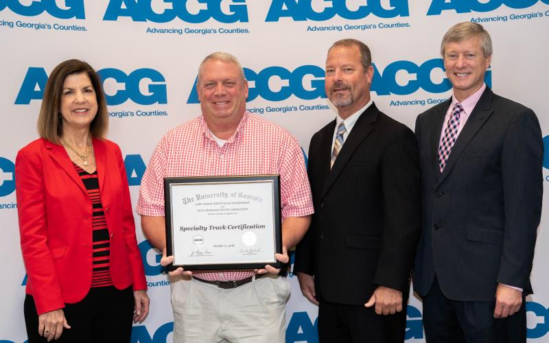 Stephens County commissioner Dennis Bell (second from left) recently received the economic and community development specialty track from the ACCG’s Lifelong Learning Academy.